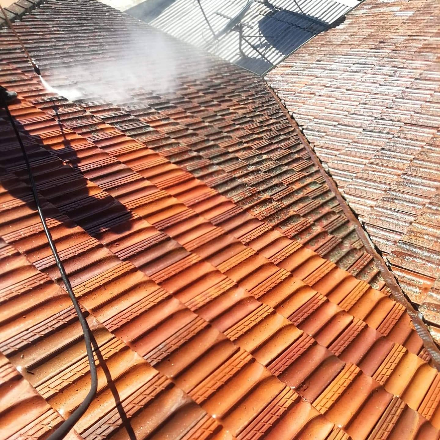 dirty roof tiles pressure washed in Burrum Heads 
